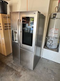 Fridge stainless steel LG with extra door deluxe freezer and refrigerator works perfect