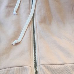 Ladies blush pink hoodie with wavy hemline