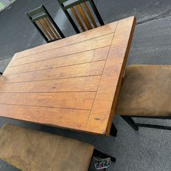 Table With 4 Leather Chairs And 1 Bench 