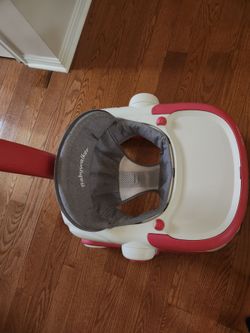 Adjustable height baby walker with accessories
