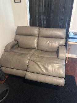 Gray two seater loveseat leather