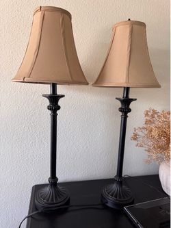 Beige color pair of bedside lamps