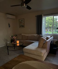 L shaped couch / peach/beige