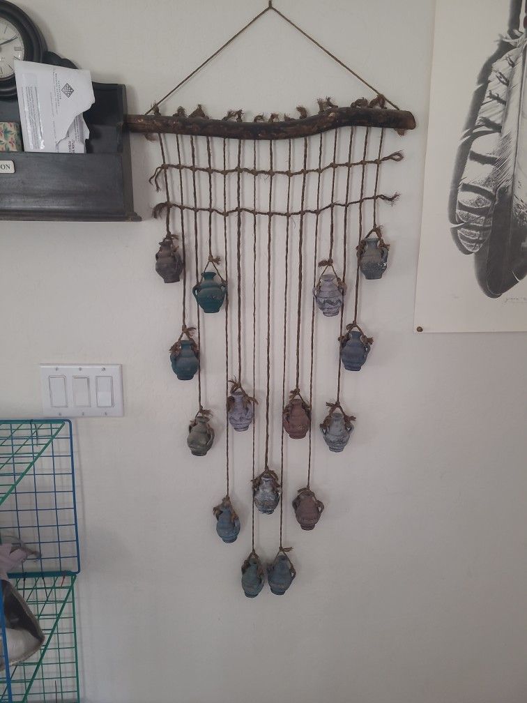 Wall hanging with miniature ceramic pots