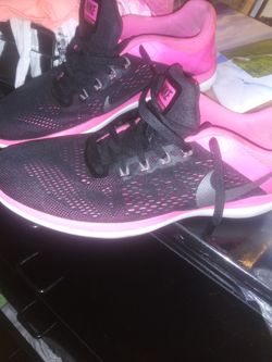Women pink black nike size 10