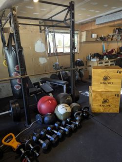 CrossFit gym with Rogue rack, bars, weights, many extras