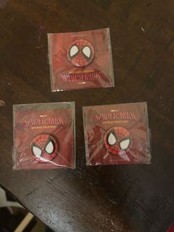 A pack of three promotional Spider-Man: Brand New Day collectible pinback button in its sealed plastic packaging