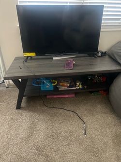 Roku 40inch Tv and gray and blackish stand