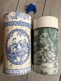 Two vintage cylindrical decorative storage box