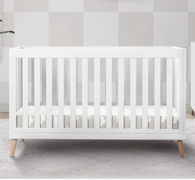 Delta Children Essex 4-in-1 Convertible Baby Crib, Bianca White with Natural Legs