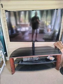 Glass and Wood TV Stand with Integrated Mount and TV info 👇