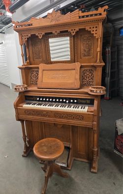Carved antique pedal parlour organ.