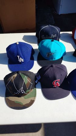 17 hats. New Era and Brand Snap Backs