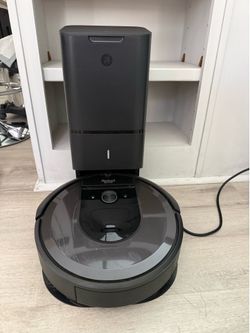 iRobot Roomba i7 with self emptying.  Bluetooth ready  Some small scratches  on the top.