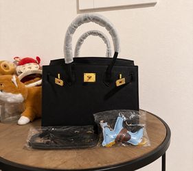 Price is negotiable. Luxury Black Leather Handbag – Gold Hardware – Excellent Condition
