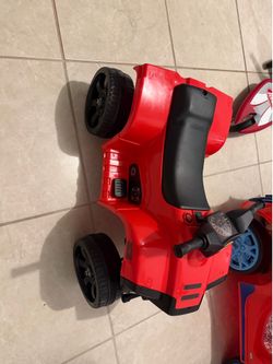 Used Electric Red  Ride Along Toy