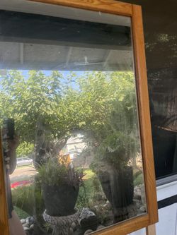 Mirrors and used clothes and jackets and home stereo system