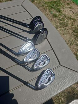 Ram axial golf club set. Three drivers. Four irons. No putter