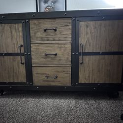 Wooden and black metal dresser