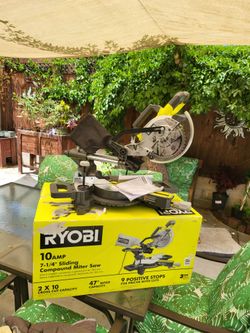 Ryobi 10 amp 7-1/4 inch sliding compound miter saw with . Includes original box and original blade.