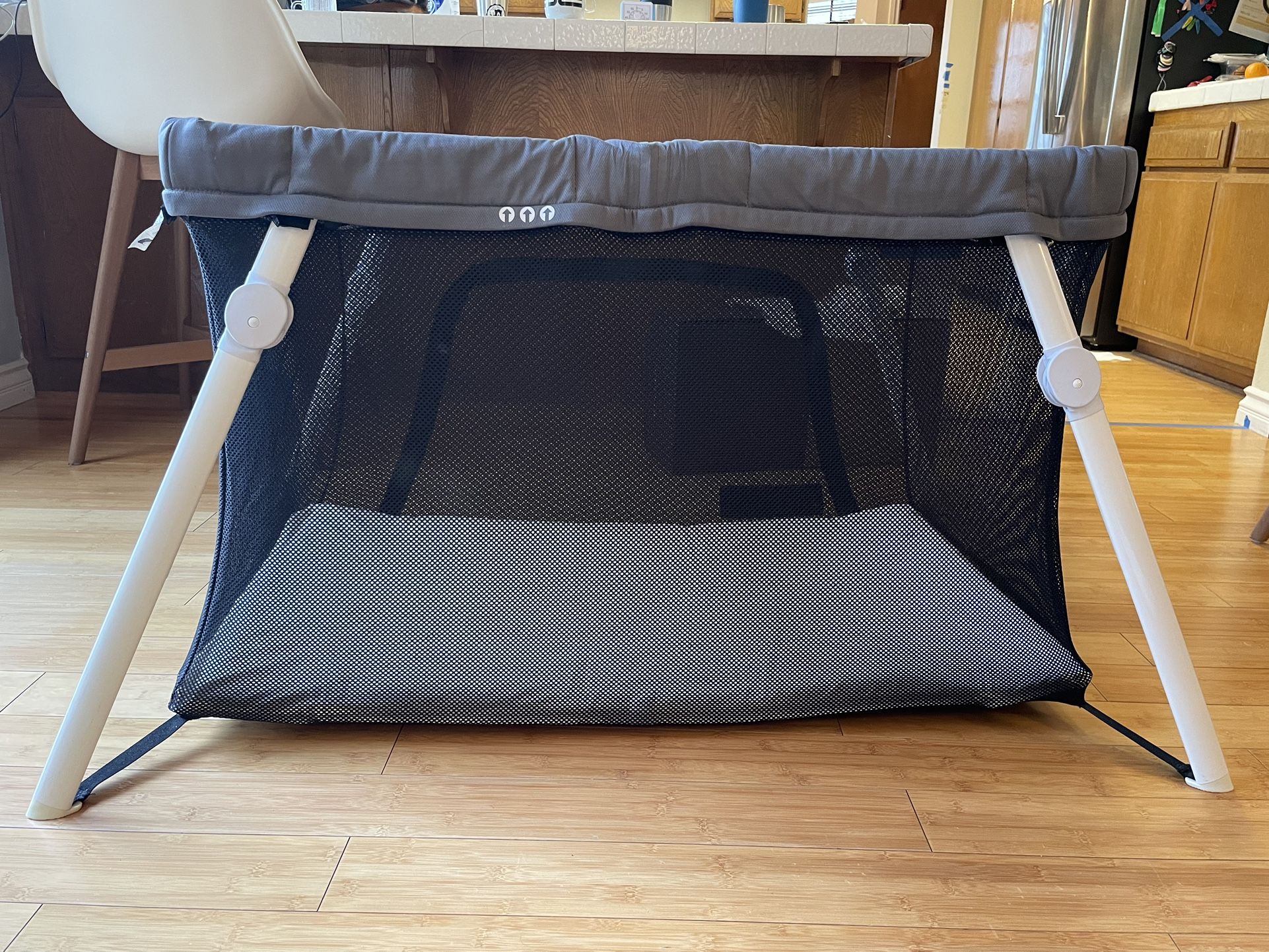 Guava Family Lotus Travel Crib and bassinet conversion set.