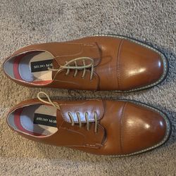 Bruno Marc Size 10 Men's Leather Dress Shoes are formal oxford-style shoes featuring a classic cap-toe design and durable leather construction.  Step 