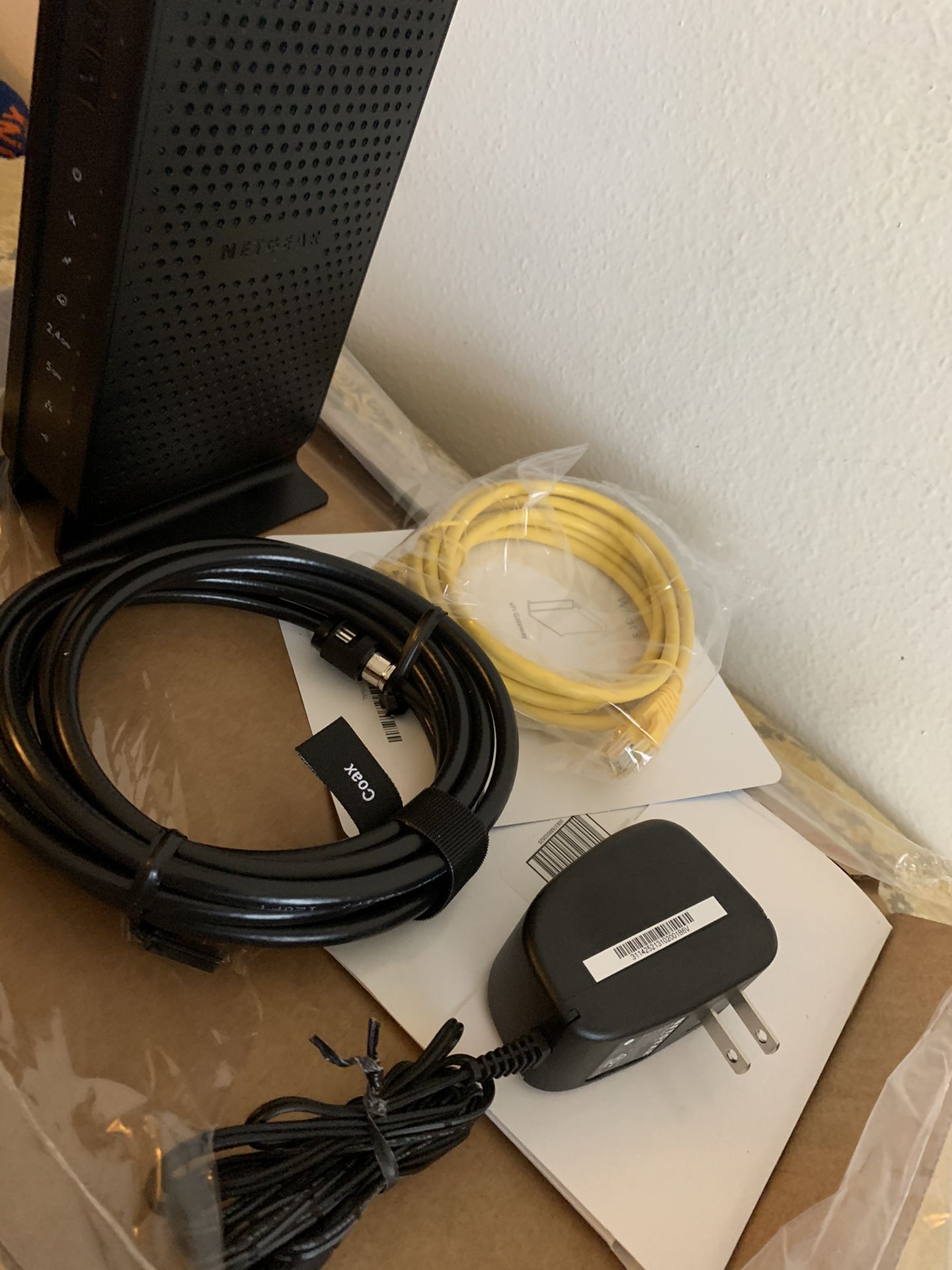 Xfinity Comcast modem router, cable coax, WiFi cable.