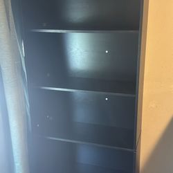 4 black bookshelves