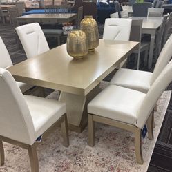 Gold Dining Table with six chairs. 