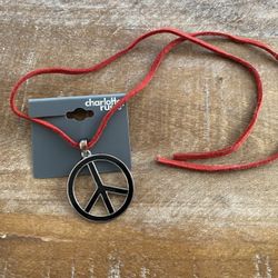 Never used enamel Peace Sign Necklace on a red cord.