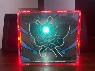 Twilight Masquerade Elite Trainer Box 120$ comes with glass case and free pop Pikachu .