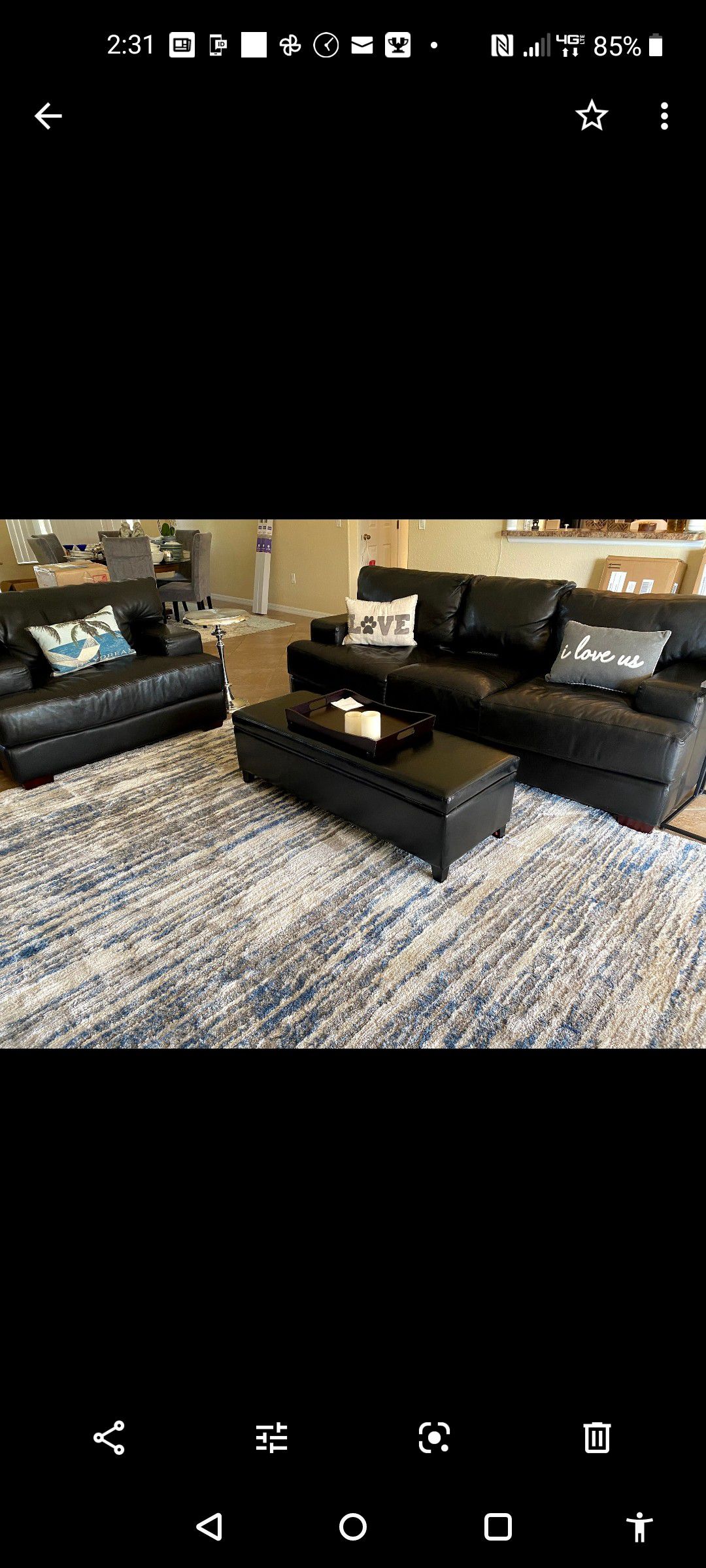 Black leather couch and chair