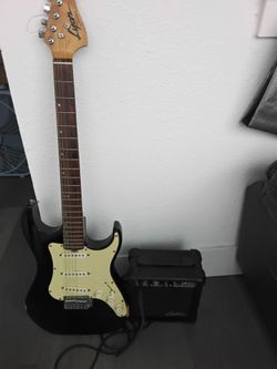 Guitarra eléctrica con su equipo de amplificador de sonido de uso