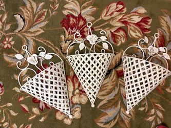 Three vintage metal wall decorations