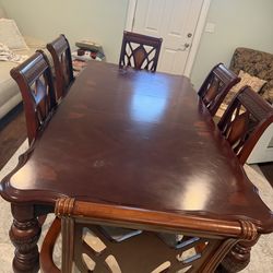Dark Wood table anda 6 chairs.