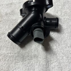 Thermostat housing assembly