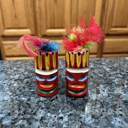 Vintage Wooden Totem Poles Hand Painted Red with feathers pair of  Salt and Pepper Shakers.  , made in Japan.  Preowned used normal use.  With cork st