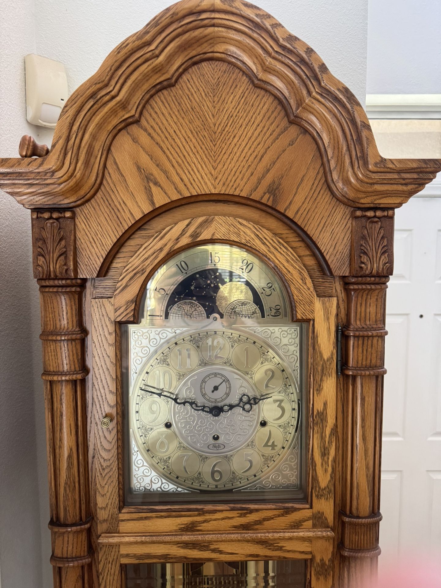 Beautiful Sligh Grandfather Clock in medium oak.