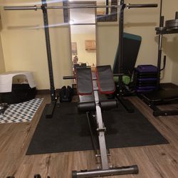 Titan Barbell, Squat Rack And 2 45 Pound Bumper Plates 