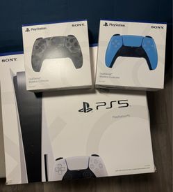 PS5 and 2 controllers