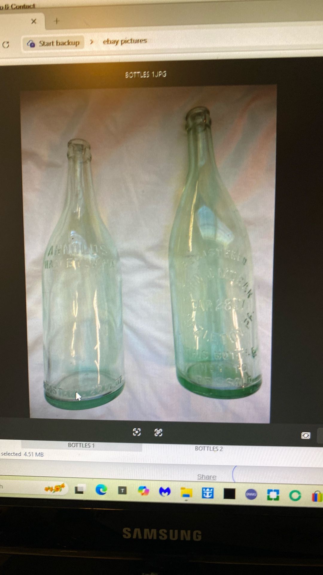 2 antique green glass bottles, 28 fluid ounces,