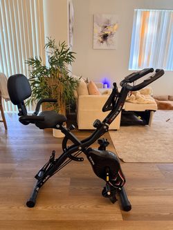 KALWOL 5-in-1 Foldable Exercise Bike – 16-Level Resistance + Backrest