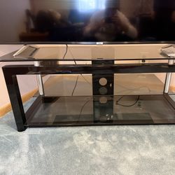Brand New Tv Stand With Glass Shelving 