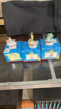 Three Peter Pan trinket boxes