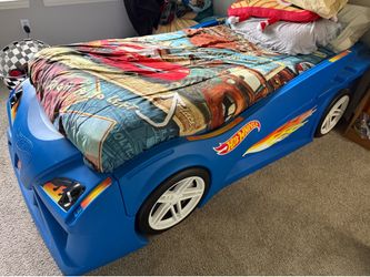 Kids hot wheels race car bed with mattress.