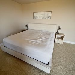 King bed frame with two night stands.