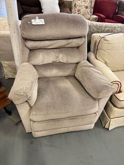 Tan rocking recliner chair (in store)