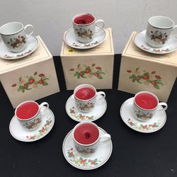 Strawberry demitasse cups, saucers and matching plates with 22 karat gold trim 