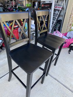 2 dark brown / black stools