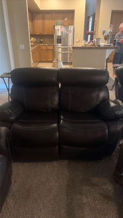 Brown leather couch and love seat